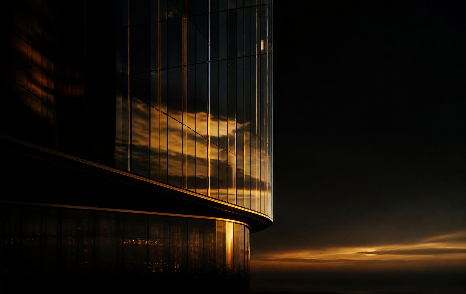 Golden dusk light on a modern glass tower